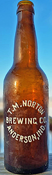 T. M. NORTON BREWING COMPANY EMBOSSED BEER BOTTLE