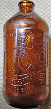 DUQUESNE BREWING COMPANY DUKE BEER EMBOSSED BEER BOTTLE